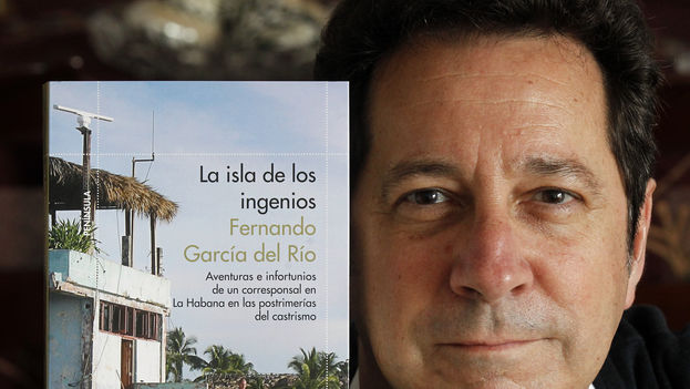 Fernando Garcia poses with a copy of his book 'The Island of the Ingenuous”. (Photo: Esteban Cobo)