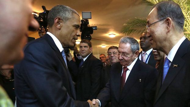 Barack Obama and Raul Castro shake hands at the opening of the Americas Summit