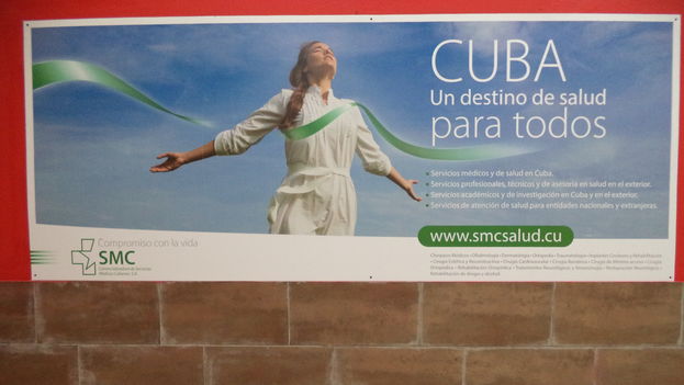 Promotional posters for Cuban Medical Services in the departure terminal at Havana’s Jose Marti Airport. (14ymedio)