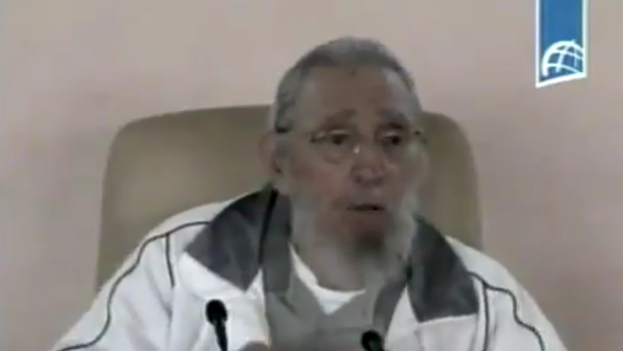 Fidel Castro talks with students and teachers during a tribute to Vilma Espin. (TV)