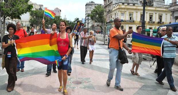 Cuban homosexuals parade with their flags on the Paseo del Prado in Havana. Taken from the Independent.