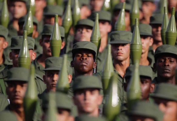 Cuban soldiers carry rocket propelled grenade launchers during a military parade in Havana's Revolution Square April 16, 2011.
